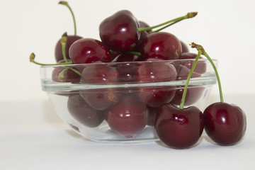 Fresh cherries in a bowl on the table