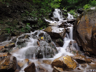 Waterfall at the carpatian mountains green forest