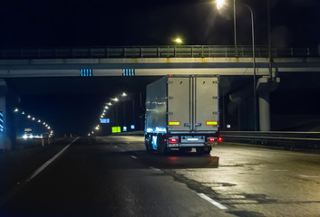 Fototapeta na wymiar truck moves on highway at night
