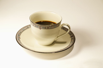 Cup and coffee, white background