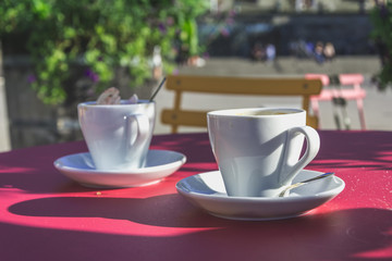 Two White Coffee Cups in Summertime Outdoors