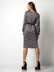 Young beautiful woman posing in new fashion gray winter dress full body