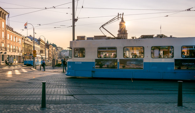 Gothenburg, Sweden - August 23, 2017: A Modern Blue Tram in Gothenburg with Sunset in the Background