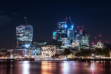 Obraz premium Skyscrapers Urban Buildings over the River Thames at Night, London Cityscape, England