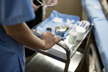 Nurse preparing medical equipments