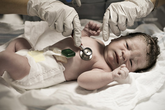 Newborn Baby getting APGAR examination