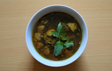 Rawon. Traditional Indonesian beef black soup, originally from Surabaya. Served with steam rice, salted egg, bean sprouts & chili sauce.