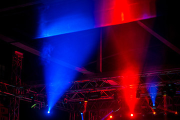 Stage lights on metal construction during a concert