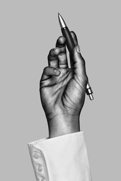 Business hand writing with silver pen. Black and white photo.