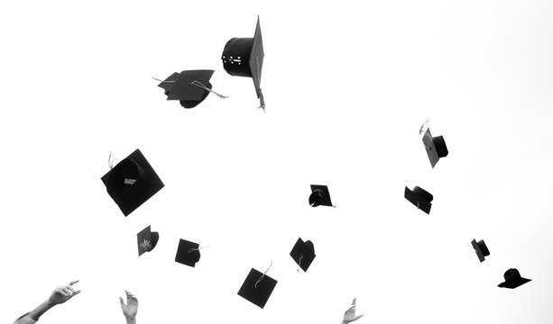 Mortar boards in the air at a graduation