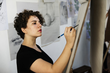 Woman working on painting