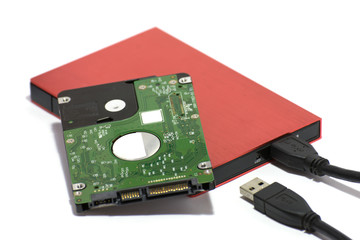 Laptop Hard disk 2.5 inch. red external hard disk box and usb cable on white background.