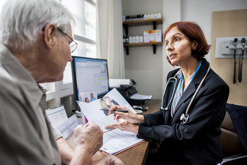 An elderly patient meeting doctor at the hospital