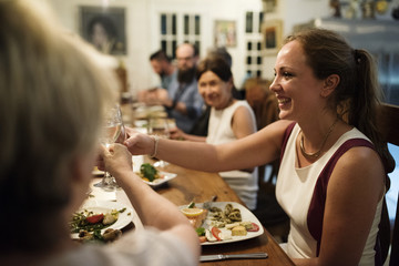 Group of diverse friends are having a dinner together