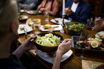 Group of diverse friends are having a dinner together