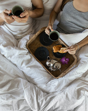Couple Drinking Coffee in Bed