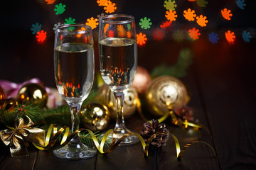 New year celebrating concept. Two glasses of champagne, fir tree
