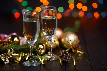 New year celebrating concept. Two glasses of champagne, fir tree