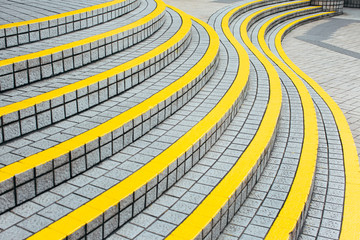 Curved stairway with yellow demarcation lines