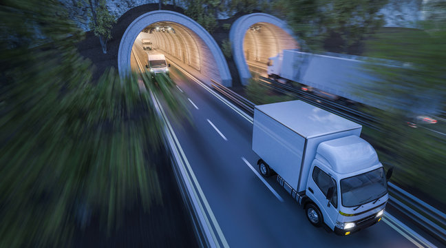 Various Commercial Vehicles Moving through Tunnels