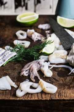 Preparing squid on a chopping board for a recipe.