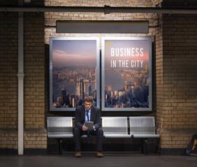 Businessman waiting in an underground train station