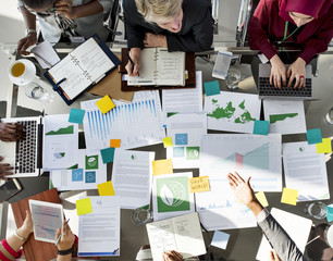 A Group of Business People in a Meeting about Environment