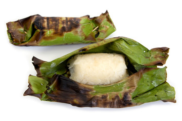Wrapped of grilled stick rice with banana leaf isolated on white background.