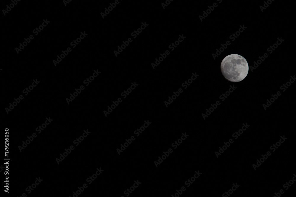 Wall mural the moon in the dark sky.