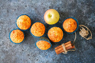 Homemade apple cheese muffins. Blue stone background. Seasonal baking. Top view.