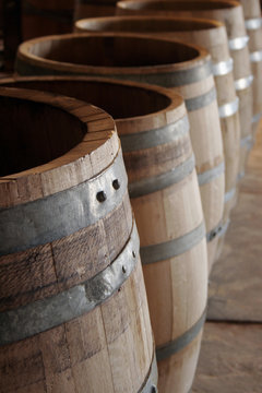 Hoops and rivets on lined up oakwood barrels
