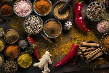 Spices and herbs in wooden bowls. Food and cuisine ingredients
