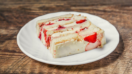 A piece of homemade cake with cream
