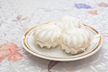 Sweet marshmallows on plate