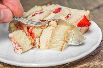 A piece of homemade cake with cream