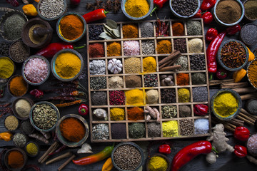 Wooden box with spices and herbs