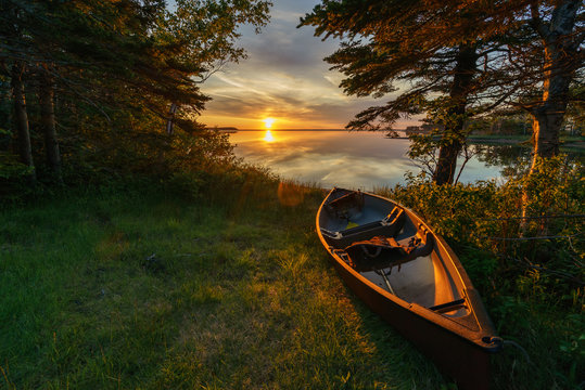 Empty canoe at sunset