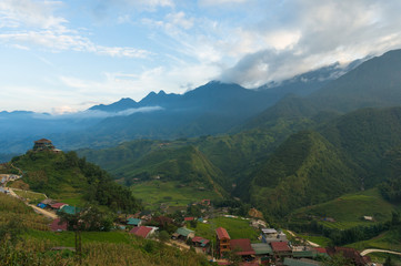 Fototapeta na wymiar Aerial view on mountain range valley village