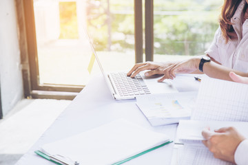 Fototapeta premium Businessman and Businesswoman work business planning. The blank screen with copy space for your text or advertising content. Selective focus. Clipping path in picture.