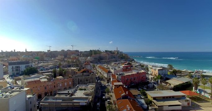 Ascending aerial shot from a side street to the sky above Tel Aviv ALTERNATIVE VERSION