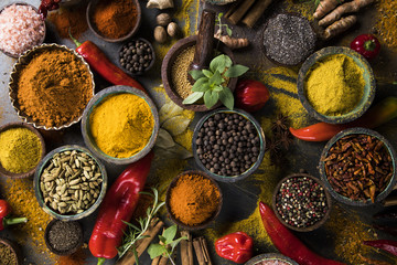 Variety of spices and herbs on kitchen table