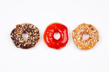 Delicious donuts with chocolate almond, strawberry jam and almond caramel glazed, Isolated on white background. Selective focus.