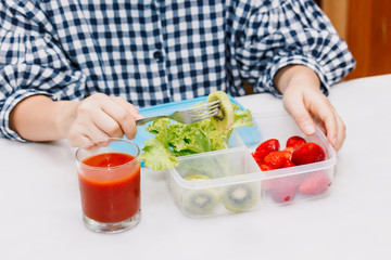 Woman eating fruit and vegetables in the kitchen.healthy lifestyle concept