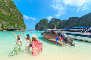 MAYA BAY, THAILAND - April  22, 2017: Crowds of sunbathing visitors enjoy a day trip boat ride to...