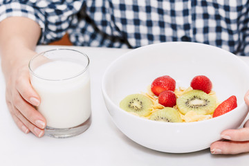 Woman dieting eating cereal and having breakfast in the kitchen.healthy lifestyle concept