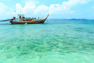 Fototapeta premium Longtail boats floating on the Sea at Phuket, Thailand. Summer, Travel, Vacation and Holiday concept.