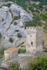 Fototapeta na wymiar Ancient Genoese fortress tower and temple
