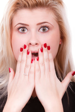 Shocked woman covering mouth with hands
