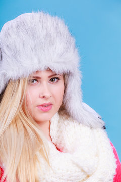 Blonde woman in winter warm furry hat