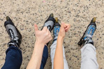 Fototapeta premium People friends with roller skates outdoor.